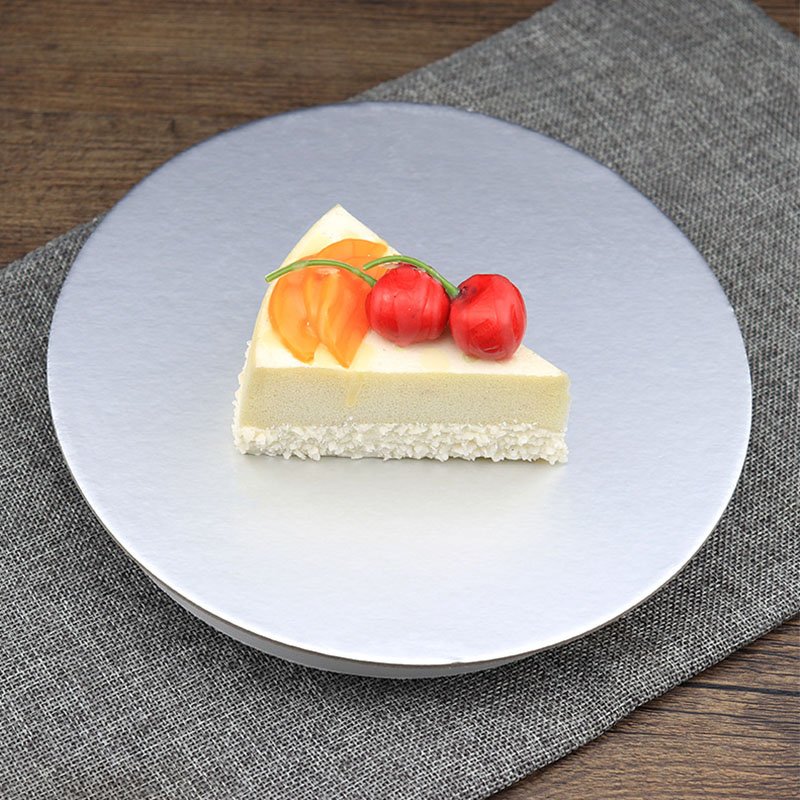 sliver paper cake board in use for cake