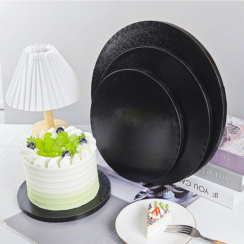 Wholesale Black Round Cake Drums 10 Inch Bulk Cake Boards for Bakeries Wholesale black round cake drums bulk pack stacked for bakeries and distributors