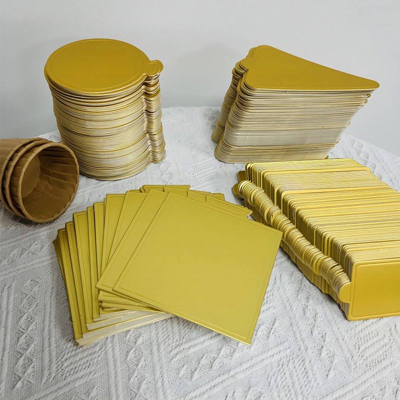 Gold Mini Paper Cake Boards Dessert Trays for Mousse Cake Gold dessert trays stacked for bakeries cafes and wholesale supply