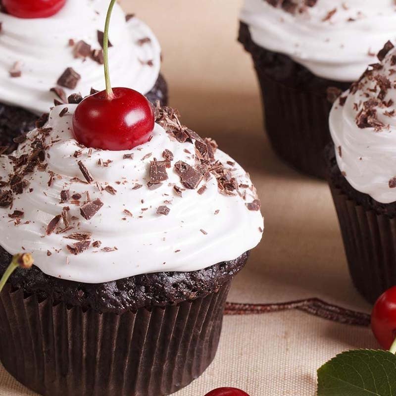 Greaseproof Brown Paper Cupcake Liners Kraft Muffin Baking Wrappers Cupcake baked in kraft paper cupcake liner with cherry topping